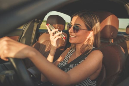 woman talking on phone while driving